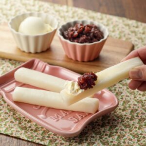 Toasted mochi sticks dipped in vanilla ice cream and sweet red bean paste