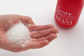 Light lather of Keana Baking Soda Scrub Wash in the palm