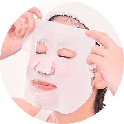 Placing Keana Rice Mask on the face, eyes first and then mouth